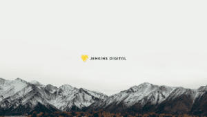 Mountain range with grey sky and the Jenkins Digital logo centre.
